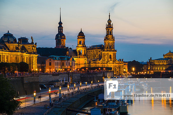 Germany  Saxony  Dresden  View of Bruehl's Terrace  Sekundogenitur  Hausmann Tower  House of the Estates  Dresden Cathedral  Semper Opera House and Augustus bridge with Elbe waterfront in the evening