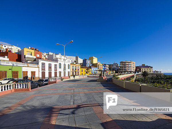 Spain  Canary Islands  La Palma  Puerto de Tazacorte  colourful houses  waterfront promenade