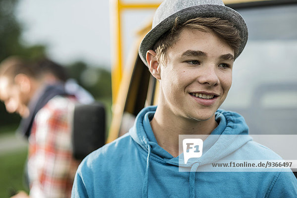 Smiling teenage boy wearing hat