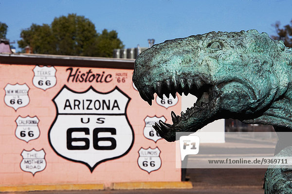 Close up of dinosaur statue by Historic Route 66 sign  Holbrook  Arizona  United States