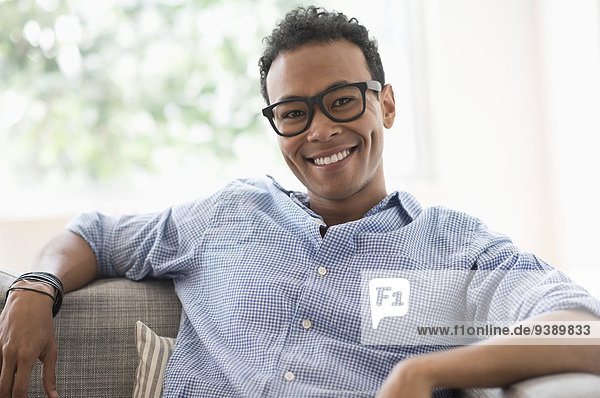 Portrait of young relaxed man smiling