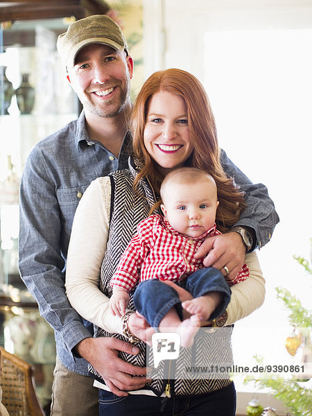 Studio shot portrait of family with one child (2-5 months)