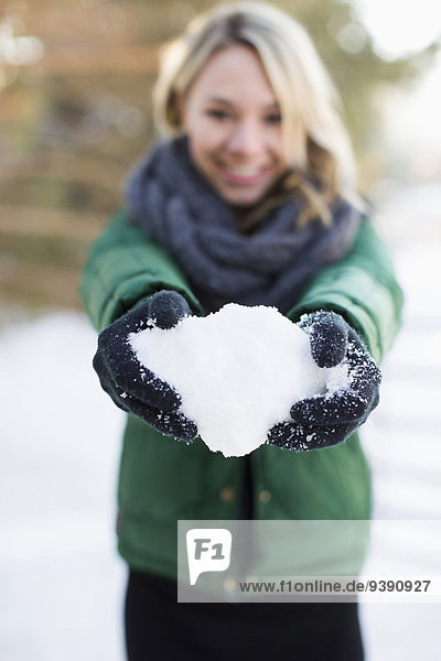 Woman holding snowball