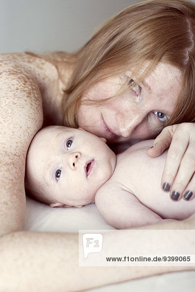 Mother embracing baby  portrait