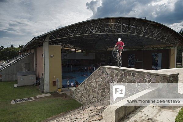 One man riding his bike at the ITESO University in Guadalajara  Jalisco  Mexico.