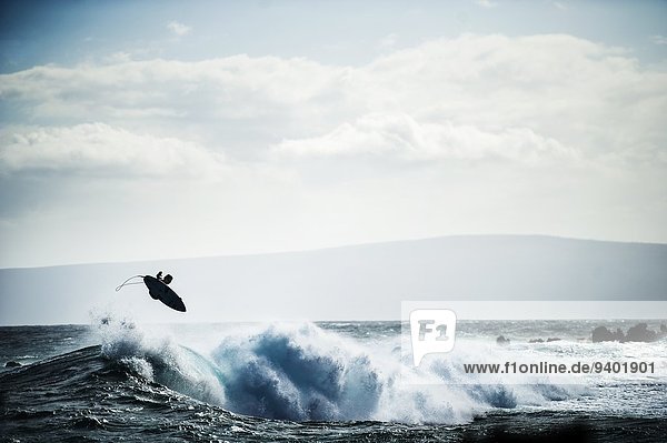 Surfer boosts air in Maui