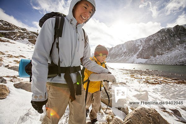 Mother and son enjoy a hike along a snow filled Gap Trail