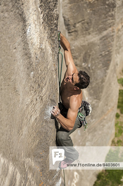 Lucas Iribarren climbs a 7a+ route in Balmanolesca  the most historical granite crag in Ossola  Italy.