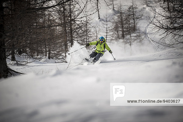A backcountry skier descends a steep slope in Devero  Ossola  Italy.