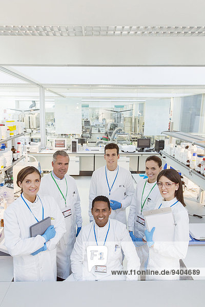 Scientists smiling in laboratory