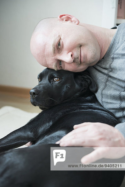 Portrait of man with his dog,  smiling