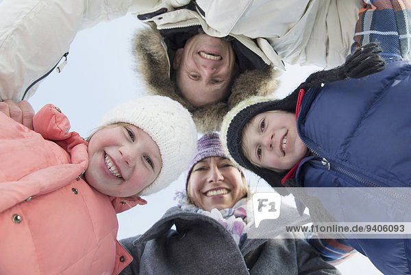 Portrait of family in winter  smiling