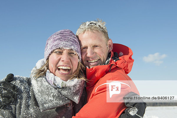 Portrait of couple in Winter  smiling