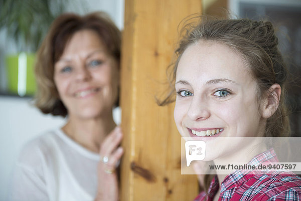 Grandmother and granddaughter  smiling