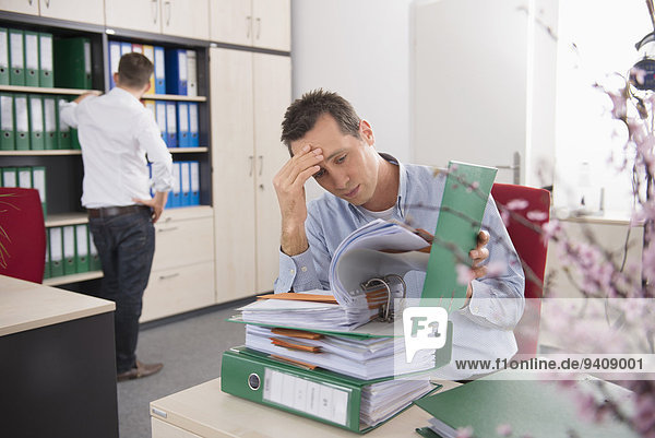 Two young men worried deadline tax stress