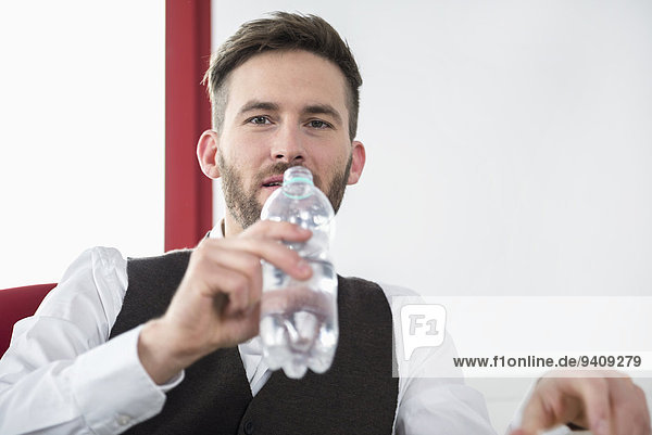 Young man office thirsty drinking water