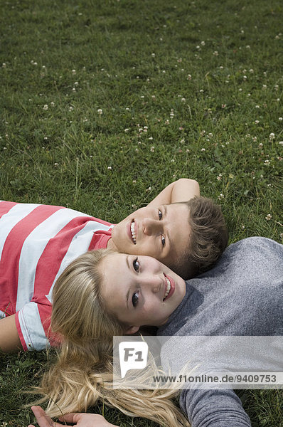 Portrait of teenage couple relaxing  smiling