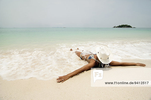 woman lying on the beach  Koh Lipe  Thailand