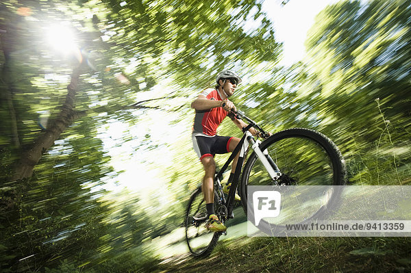 Man mountain biking in Isar footplains