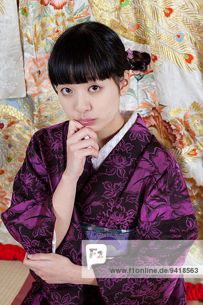 Young Japanese Girl In A Kimono