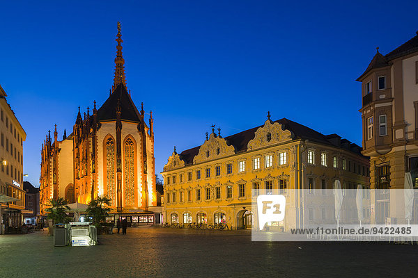 The illuminated Falkenhaus building and the Marienkapelle church  Market Square  historic centre  at night  Würzburg  Bavaria  Germany