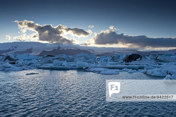 Evening mood  sun behind clouds  glacier lagoon of Jökulsárlón  Southern Region  Iceland
