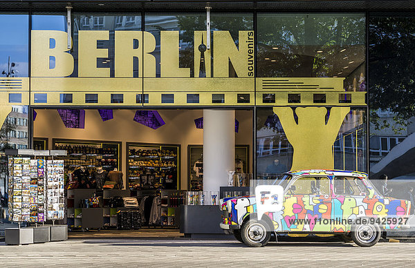 Souvenir shop with colourful Trabant car at Alexanderplatz square  Berlin  Germany