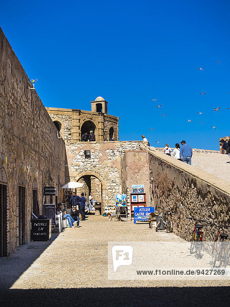 City walls  Bani Antar  with hawkers in the historic centre of Essaouira  Unesco World Heritage Site  Morocco  North Africa