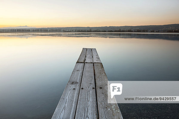 Jetty at dawn  view towards Reichenauallee on Lake Constance  Hegne  Baden-Wuerttemberg  Germany  Europe  PublicGround