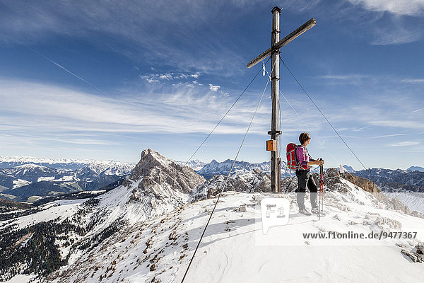 Mountaineer on the summit of Mt Tullen  Val di Funes  Mt Peiterkofel at the back  Dolomites  Funes  Eisacktal valley  Province of South Tyrol  Trentino-Alto Adige  Italy  Europe