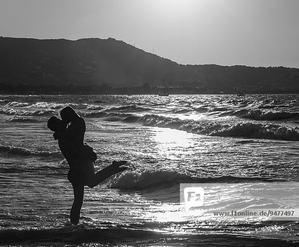 Young couple on the beach kissing  Corsica  France  Europe