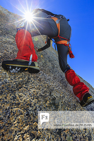 Climber climbing on a rock wall  alpine climb  Alps  below the summit  Petite Forch  Canton of Valais  Switzerland  Europe