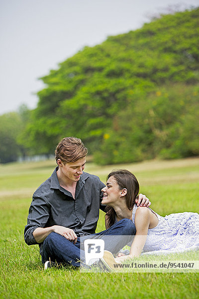 Young couple together in park