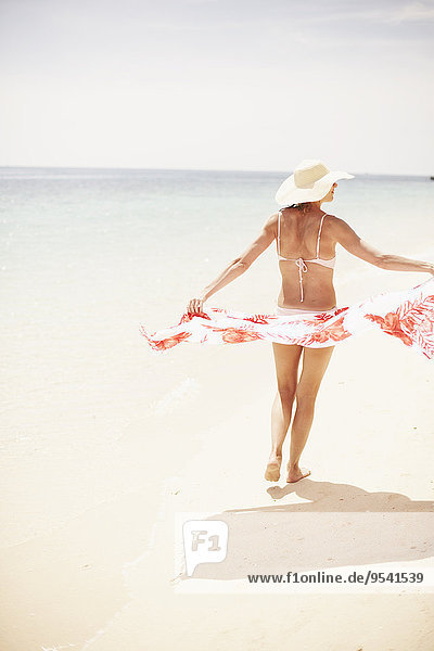 Woman with pareo on beach