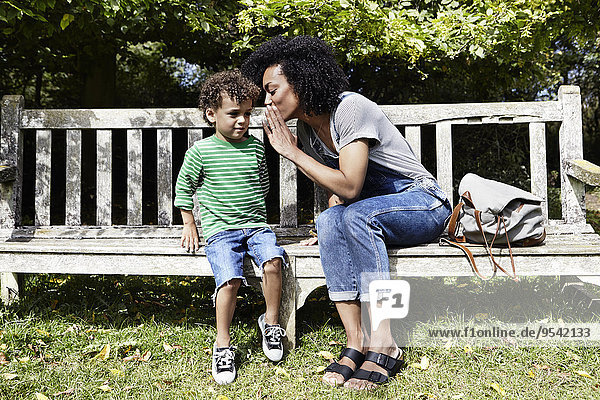 Mother and son on bench