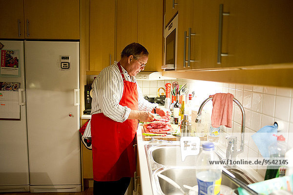 Senior man in kitchen