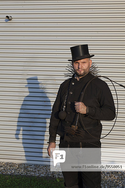 Germany  portrait of chimney sweep with working tools