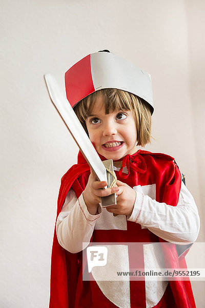 Portrait of little girl masquerade as a knight