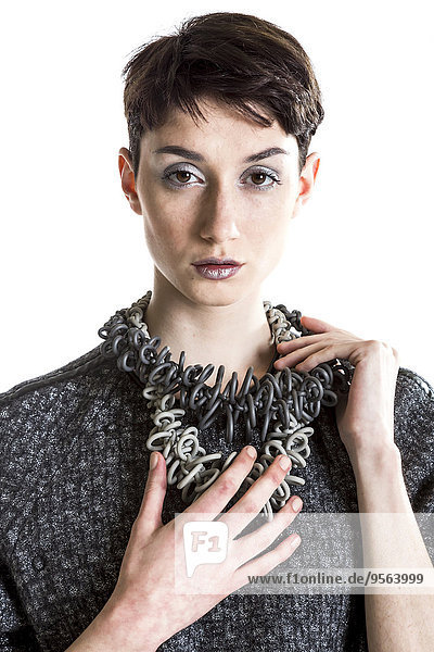 Portrait of Young Woman wearing Modern Jewellery  Studio Shot