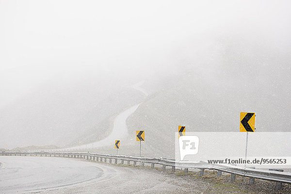 High angle view of mountain road in foggy weather
