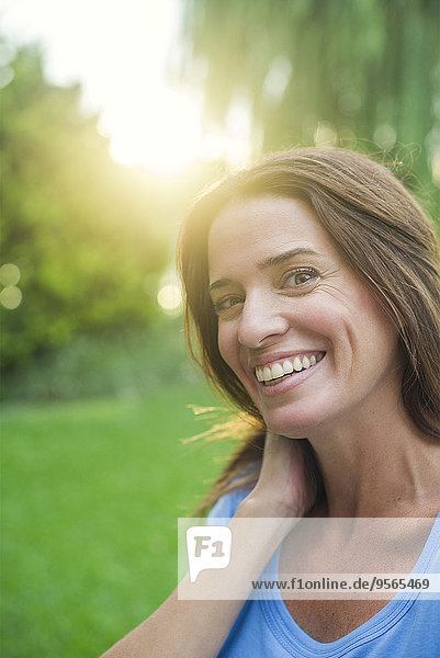 Woman smiling outdoors  portrait