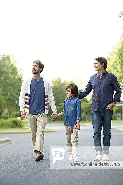 Fathers and son walking together outdoors