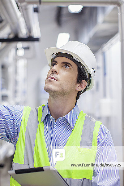 Technician inspecting industrial plant