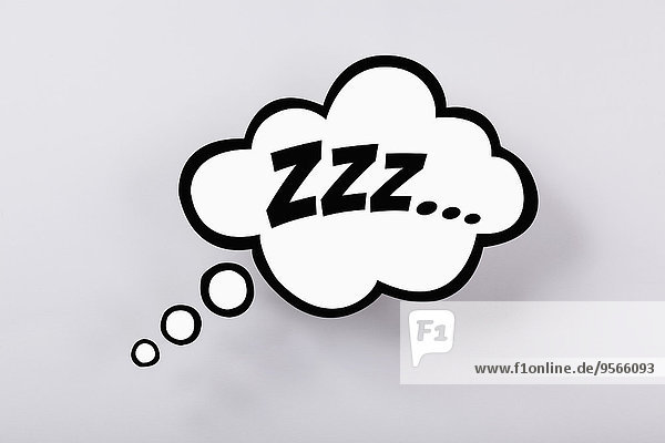 Snoring sign in thought bubble against gray background