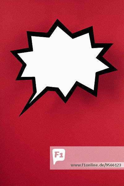 Blank exploding speech bubble against red background