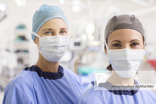 Portrait of female doctors wearing scrubs in operating theater