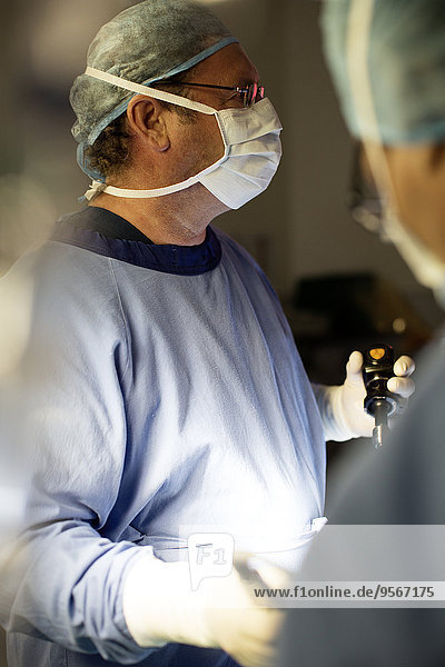 Doctor performing laparoscopic surgery in operating theater