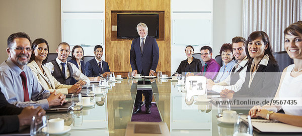 Business people posing in conference room