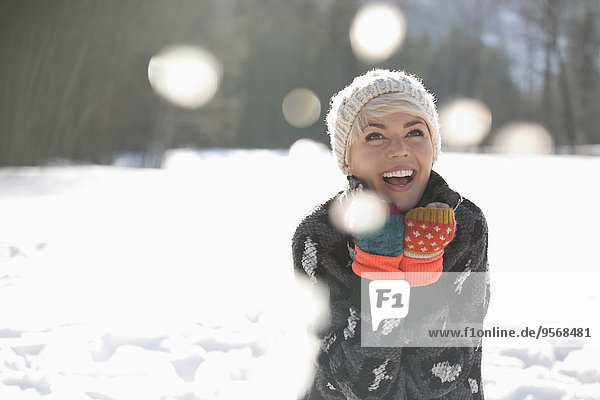 woman laughing in snow