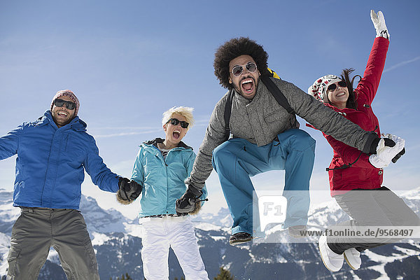 Portrait of exuberant friends in snow